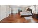 Expansive bedroom featuring hardwood floors, modern furniture, and a cozy bed for ultimate relaxation at 701 Fir Chase, Fairburn, GA 30213