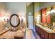 Spacious bathroom with granite countertops, dual sinks, vanity area and decorative lighting at 12 Blackfoot Trl, Sharpsburg, GA 30277