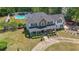 Beautiful home with a stone accent, covered porch, and circular driveway at 12 Blackfoot Trl, Sharpsburg, GA 30277