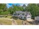 Charming home with a large front yard, covered porch, and attached garage at 12 Blackfoot Trl, Sharpsburg, GA 30277