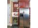 Close-up of kitchen featuring wine cooler and stainless refrigerator at 12 Blackfoot Trl, Sharpsburg, GA 30277