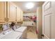 Well-equipped laundry room with washer, dryer, storage cabinets and functional layout at 12 Blackfoot Trl, Sharpsburg, GA 30277