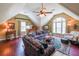 Large living room with hardwood floors, vaulted ceilings, and comfortable seating arrangements at 12 Blackfoot Trl, Sharpsburg, GA 30277