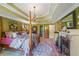 Comfortable bedroom with four-poster bed, fireplace, rug and decorative trey ceiling at 12 Blackfoot Trl, Sharpsburg, GA 30277