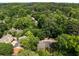Aerial view showing a property surrounded by mature trees within a quiet, residential neighborhood at 1341 Sheffield Glen Ne Way, Atlanta, GA 30329