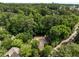 Aerial view showcasing a home nestled among lush greenery and mature trees, providing privacy at 1341 Sheffield Glen Ne Way, Atlanta, GA 30329