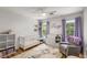 Bright Bedroom with hardwood floors, natural light and lilac decor at 1341 Sheffield Glen Ne Way, Atlanta, GA 30329