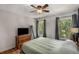 Comfortable bedroom with wood floors, natural light, and a ceiling fan at 1341 Sheffield Glen Ne Way, Atlanta, GA 30329