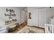 A calm Bedroom featuring hardwood floors, a closet, and natural light from an open door at 1341 Sheffield Glen Ne Way, Atlanta, GA 30329