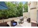 Private deck with seating and a grill surrounded by greenery, great for outdoor relaxation at 1341 Sheffield Glen Ne Way, Atlanta, GA 30329