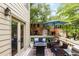 Enjoy outdoor living on this deck with comfortable seating and a view of the surrounding trees at 1341 Sheffield Glen Ne Way, Atlanta, GA 30329