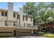 Townhome featuring a private deck above an attached garage, offering outdoor relaxation and convenient parking at 1341 Sheffield Glen Ne Way, Atlanta, GA 30329