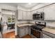 Modern kitchen boasts granite countertops and stainless steel appliances, perfect for any home chef at 1341 Sheffield Glen Ne Way, Atlanta, GA 30329