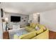 Comfortable living room features a large TV mounted on the wall and a corner sectional sofa at 1341 Sheffield Glen Ne Way, Atlanta, GA 30329