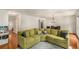 Spacious living room with hardwood floors, comfortable seating, and natural light from the windows at 1341 Sheffield Glen Ne Way, Atlanta, GA 30329