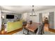 The spacious living room and dining room offers space for gatherings and the yellow corner sofa at 1341 Sheffield Glen Ne Way, Atlanta, GA 30329