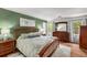 Spacious main bedroom with a large bed, lots of natural light, and matching furniture at 1341 Sheffield Glen Ne Way, Atlanta, GA 30329