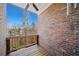Private covered balcony with brick wall and wooded view. Perfect spot to relax at 3075 Westpoint Cir, Snellville, GA 30078