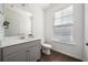Bathroom featuring a modern vanity with a white countertop and a sleek mirror at 3075 Westpoint Cir, Snellville, GA 30078