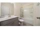 Cozy bathroom featuring a shower-tub combo and modern vanity at 3075 Westpoint Cir, Snellville, GA 30078
