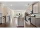 Bright, modern kitchen with granite countertops, gray cabinetry, and stainless steel appliances at 3075 Westpoint Cir, Snellville, GA 30078