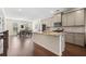 Well-lit kitchen with granite countertops, stainless steel appliances, and dining area at 3075 Westpoint Cir, Snellville, GA 30078