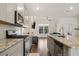 Bright, modern kitchen features stainless appliances, granite countertops, and seamless flow to the living area at 3075 Westpoint Cir, Snellville, GA 30078