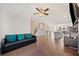 Spacious living room with hardwood floors, a comfortable couch, and an open layout at 3075 Westpoint Cir, Snellville, GA 30078