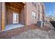Rear patio with brick exterior is ideal for outdoor living and relaxing at 3075 Westpoint Cir, Snellville, GA 30078