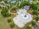 Aerial view of the community pool with water features, a slide, and a nearby clubhouse at 33 New Kent Ct, Villa Rica, GA 30180