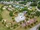 Aerial view showcasing community amenities including a playground, tennis courts, and pool at 33 New Kent Ct, Villa Rica, GA 30180