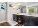 Bathroom featuring a double vanity, marble countertops, and modern fixtures at 33 New Kent Ct, Villa Rica, GA 30180