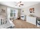 Brightly lit Bedroom room with plush carpet and serene decor at 33 New Kent Ct, Villa Rica, GA 30180