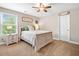 Cozy bedroom featuring a plush carpet, soft lighting, and a window view at 33 New Kent Ct, Villa Rica, GA 30180