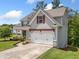 Beautiful home with a two-car garage, landscaping, and an inviting covered front porch at 33 New Kent Ct, Villa Rica, GA 30180