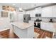 The kitchen features granite countertops, stainless appliances, and a functional kitchen island at 33 New Kent Ct, Villa Rica, GA 30180