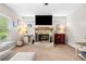 The living room features a brick fireplace and an entertainment area at 33 New Kent Ct, Villa Rica, GA 30180