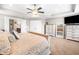 Bright main bedroom featuring neutral decor, carpet floors, and ensuite bath access at 33 New Kent Ct, Villa Rica, GA 30180