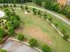 Expansive green park area with walking path, beautiful trees, and recreation for community enjoyment at 33 New Kent Ct, Villa Rica, GA 30180
