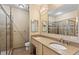 Bathroom with double vanity, shower, and neutral color palette at 3820 Roswell Ne Rd # 1001, Atlanta, GA 30342