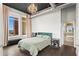 Bedroom with chandelier, hardwood floors, neutral walls, and natural light at 3820 Roswell Ne Rd # 1001, Atlanta, GA 30342