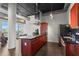 Contemporary kitchen with cherry cabinets, stainless steel appliances, a gas cooktop, and dark countertops at 3820 Roswell Ne Rd # 1001, Atlanta, GA 30342