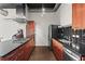 Modern kitchen features stainless steel appliances, sleek cabinetry, and a gas range at 3820 Roswell Ne Rd # 1001, Atlanta, GA 30342