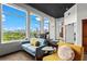 Cozy living room with city views, bright seating, hardwood floors, and a sunny atmosphere through large windows at 3820 Roswell Ne Rd # 1001, Atlanta, GA 30342