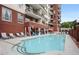 Inviting swimming pool with poolside seating and a charming building backdrop at 3820 Roswell Ne Rd # 1001, Atlanta, GA 30342