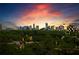 Stunning twilight skyline view surrounded by lush trees and beautiful cloudscape at 3820 Roswell Ne Rd # 1001, Atlanta, GA 30342