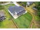An aerial view of a modern home with a long driveway and large backyard at 1349 Oak Road, Lilburn, GA 30047