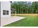 A spacious and flat backyard with lush green grass at 1349 Oak Road, Lilburn, GA 30047