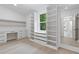 Bright, spacious closet area featuring custom shelving, drawers and a large mirror at 1349 Oak Road, Lilburn, GA 30047