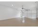 Clean and spacious three car garage with modern door and epoxy flooring at 1349 Oak Road, Lilburn, GA 30047